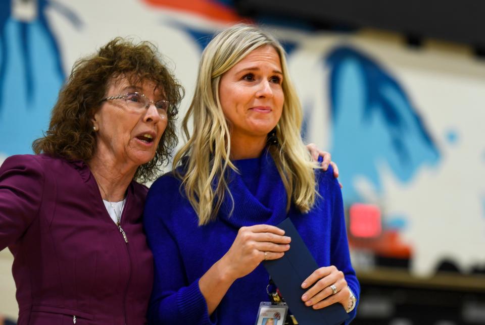 Alison Ter Horst, center, is caught by surprise as she is awarded the 2019 Milken Educator Award of $25,000 on Wednesday at Washington High School in Sioux Falls, S.D. The award recognizes educators who are considered exemplary.