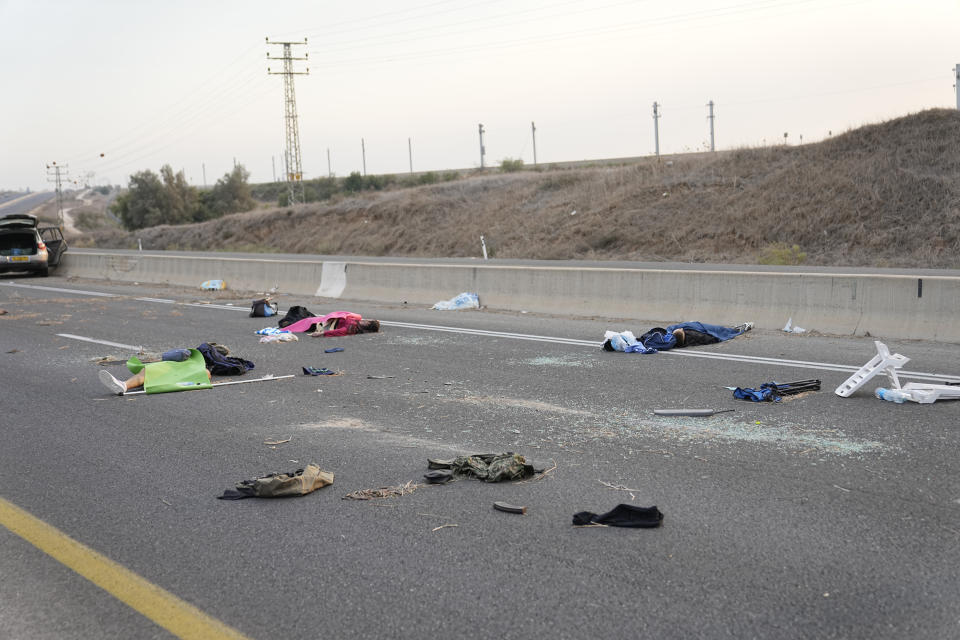 FILE - Israelis killed by Hamas militants lie on the road near Sderot, Israel, on Saturday, Oct. 7, 2023. Maj. Gen. Aharon Haliva, the head of Israel's military intelligence directorate resigned on Monday April 22, 2024 over the failures surrounding Hamas' unprecedented Oct. 7 attack, the military said, becoming the first senior figure to step down over his role in the deadliest assault in Israel's history. (AP Photo/Ohad Zwigenberg, File)