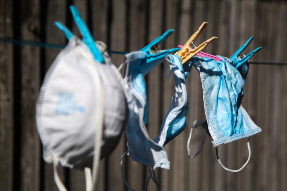 Number of washed face masks hang on a clothesline to dry during coronavirus crisis. (Photo by Dinendra Haria / SOPA Images/Sipa USA)