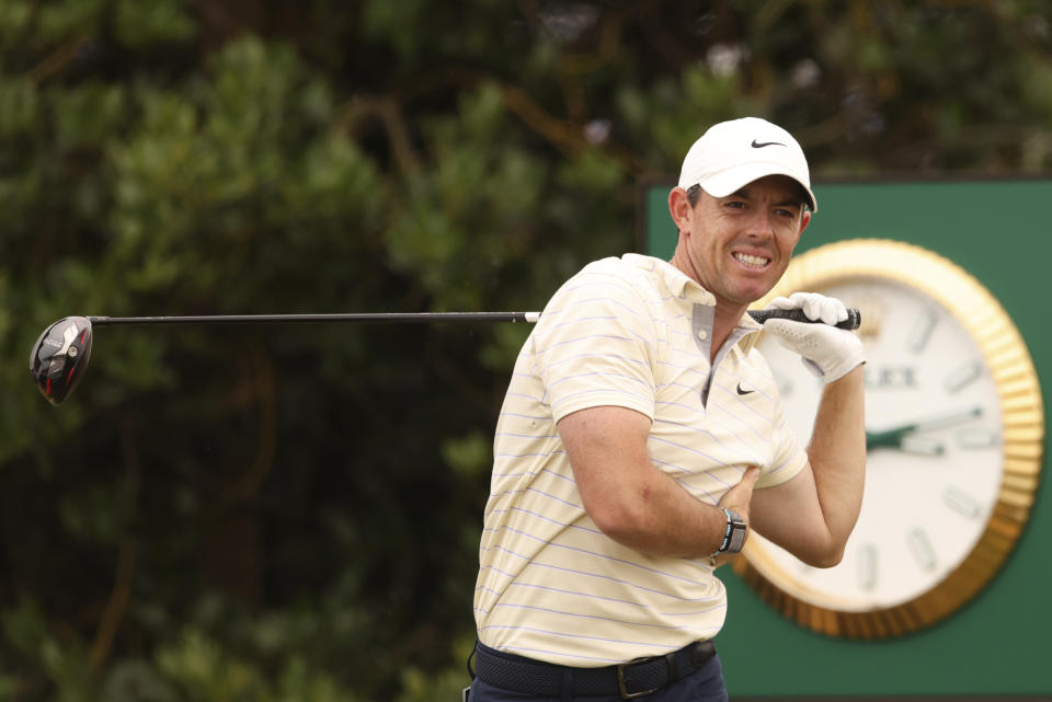 Rory McIlroy of Northern Ireland watches his shot from the 3rd tee during the final round of the British Open golf championship on the Old Course at St. Andrews, Scotland, Sunday July 17, 2022. (AP Photo/Peter Morrison)