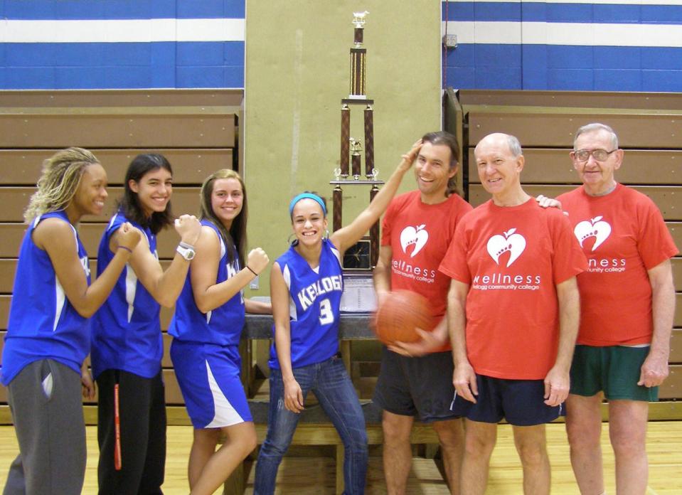 In this 2012 photo, KCC women's basketball players Malika Flenorl, Danielle Fraley, Taylor Mainstrone, and Briana Trevino banter with KCCs Graham Smith, John Wooten, and Dean Barnum.