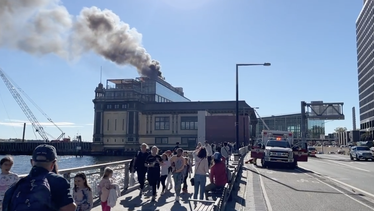 A small fire on the roof of a historic Beaux-Arts ferry terminal in Manhattan was brought under control on 24 September. (Dave MacLean/The Independent)
