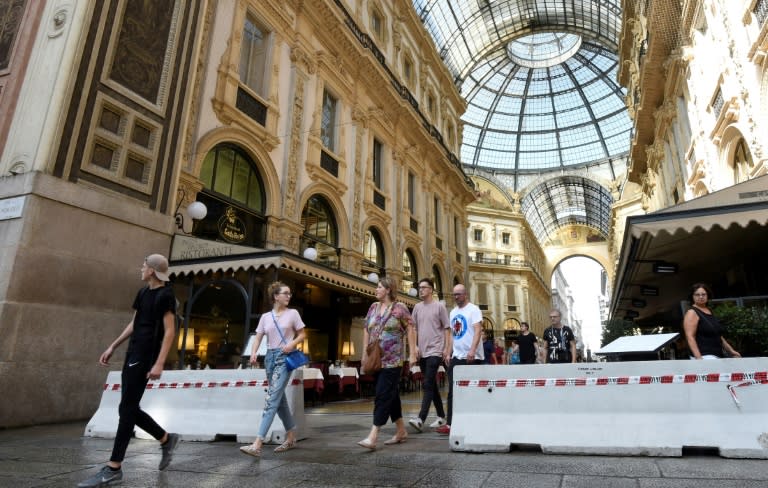 Concrete barriers have been placed at the entrance of the Vittorio Emanuel II gallery near the Duomo in Milan after the attacks in Spain