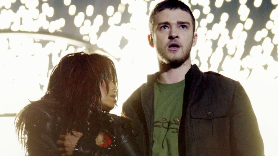 Janet Jackson (left) and surprise guest Justin Timberlake perform during the halftime show at Super Bowl XXXVIII in February 2004 in Houston. At the end of their performance, he tore away a piece of her outfit. (Photo by Frank Micelotta/Getty Images)