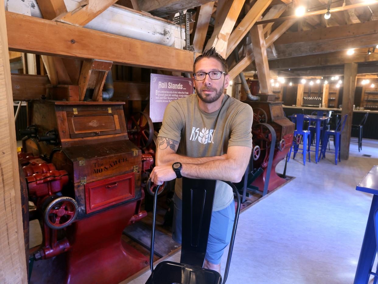 Bill Blake is a co-owner of Rising Storm Brewery and Taproom that is opening in the former Daisy Flour Mill. They have kept much of the millwork including many of the ceiling beams and the old old roll stands which ground much of the grains used by farmers.