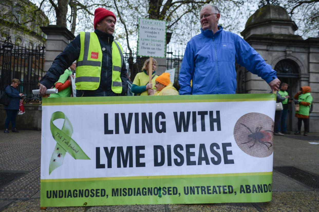 <span class="caption">Lyme disease patients hold a rally outside the Irish Parliament.</span> <span class="attribution"><a class="link " href="https://www.gettyimages.com/detail/news-photo/adults-affected-by-lyme-disease-hold-rally-outside-the-news-photo/1142259872?adppopup=true" rel="nofollow noopener" target="_blank" data-ylk="slk:Artur Widak/NurPhoto via Getty Images;elm:context_link;itc:0;sec:content-canvas"> Artur Widak/NurPhoto via Getty Images</a></span>