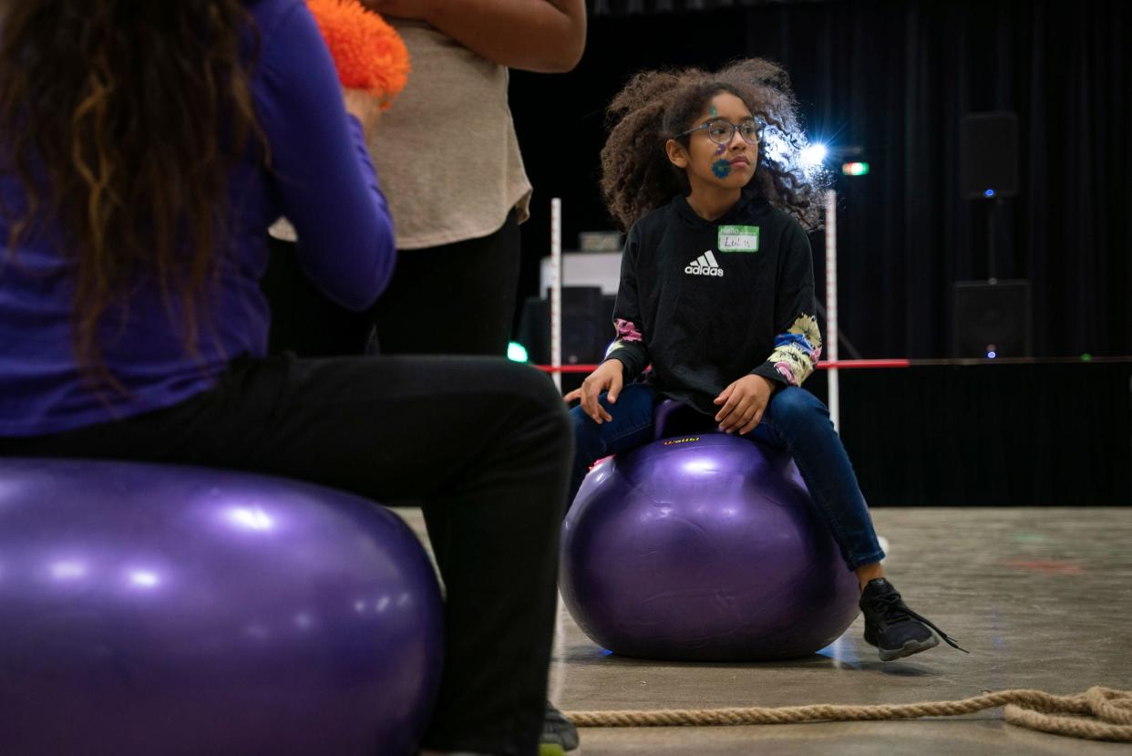 Lourdes "LuLu" Ramirez, 9, of Uvalde, a survivor of the Robb Elementary School mass shooting, plays during the Survivors United Play Day event at SSGT Willie de Leon Civic Center in Uvalde, Texas on Saturday, Nov. 19, 2022.