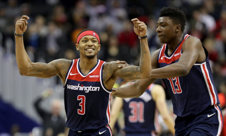 Bradley Beal #3 of the Washington Wizards celebrates with Thomas Bryant #13 after hitting a three pointer
