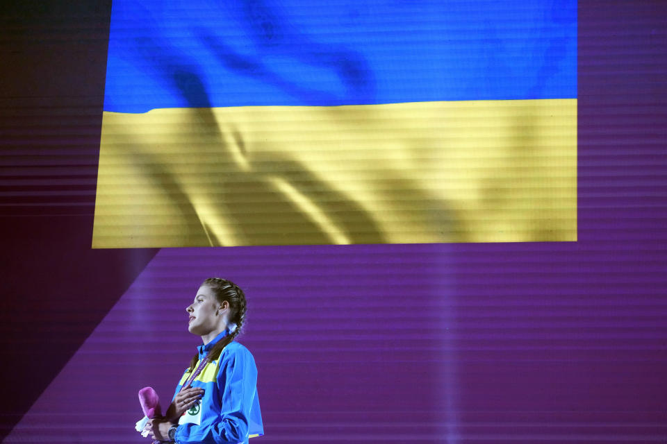 Yaroslava Mahuchikh, of Ukraine, stands on the podium after winning the gold medal in the women's high jump final at the the European Athletics Championships in Rome, Sunday, June 9, 2024. (AP Photo/Gregorio Borgia)