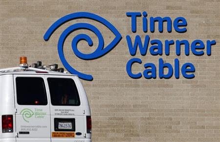 A cable truck returns to a Time Warner Cable office in San Diego, California December 11, 2013. REUTERS/Mike Blake