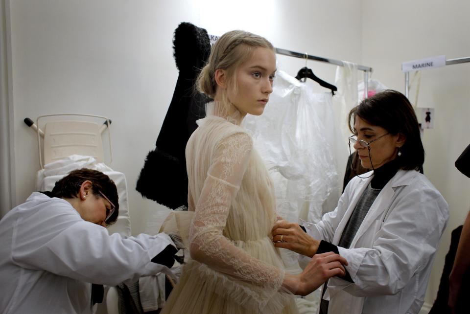 A model is dressed up backstage prior to the Valentino Spring Summer 2013 Haute Couture fashion collection, presented in Paris, Wednesday, Jan.23, 2013. (AP Photo/Christophe Ena)