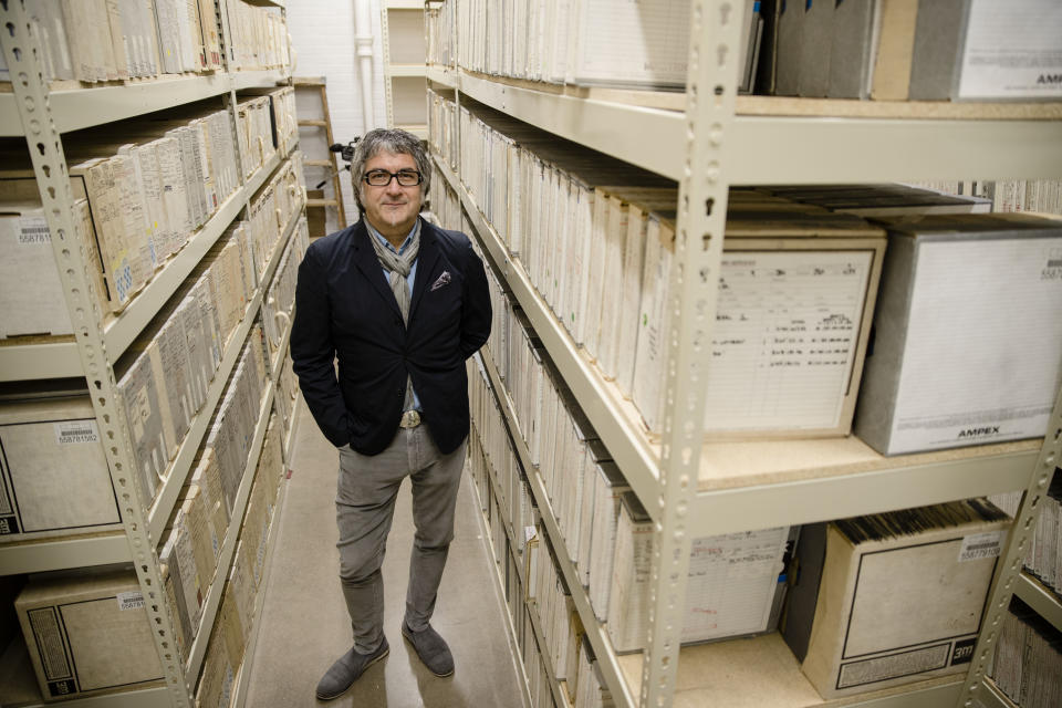 In this May 8, 2019 photo Marc Offenbach Assistant Teaching Professor, Music Industry at Drexel University poses for a portrait with music studio tapes from the Sigma Sound Studio collection, in Philadelphia. In the 1960s and 1970s, Sigma Sound helped create "The Sound of Philadelphia," the funky soul sound characterized by lush instrumental arrangements often featuring strings and horns. (AP Photo/Matt Rourke)