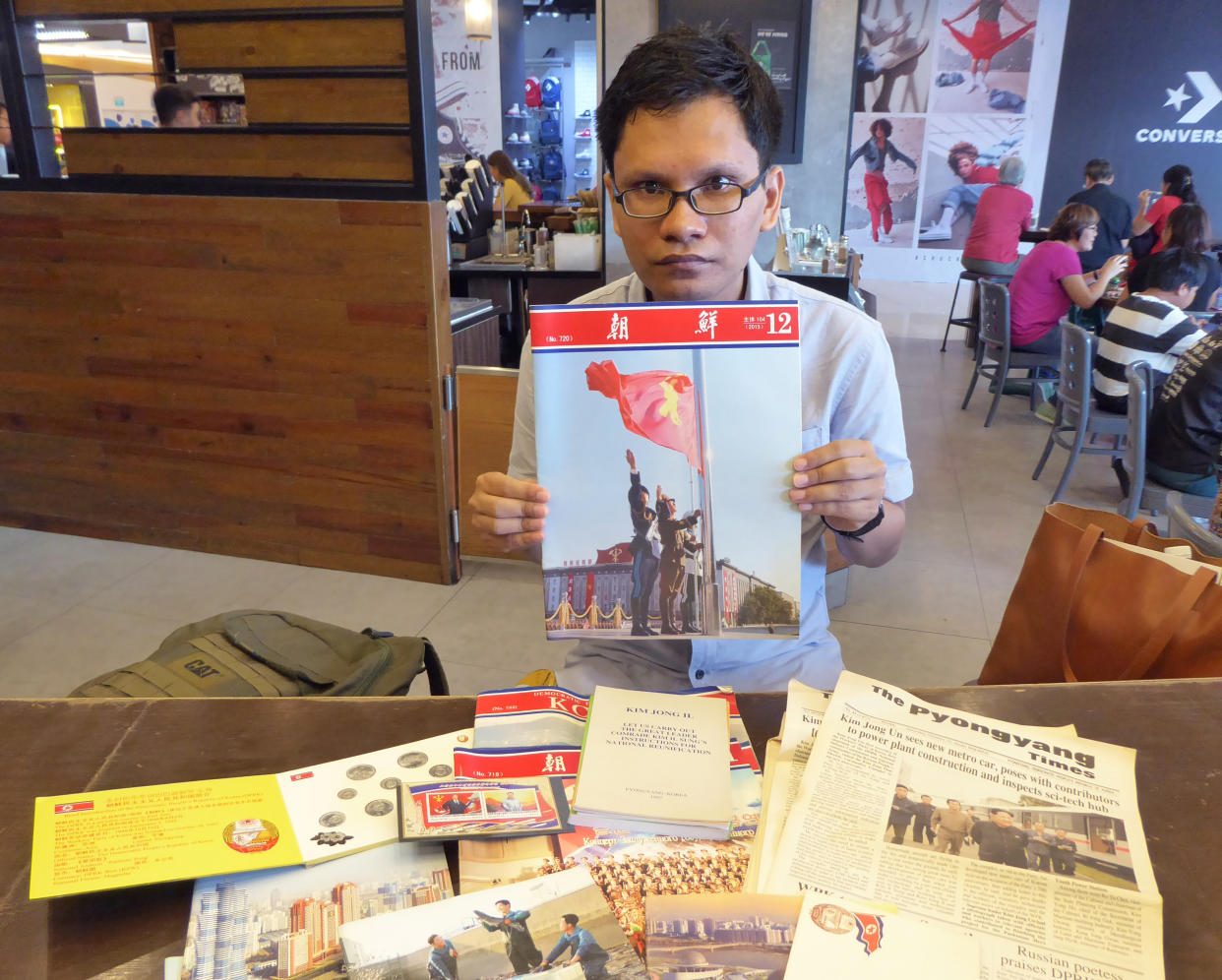 Airul Qaiz, 26, official delegate for the Korean Friendship Association, poses with his souvenirs from North Korea. (PHOTO: Nicholas Yong / Yahoo News Singapore)