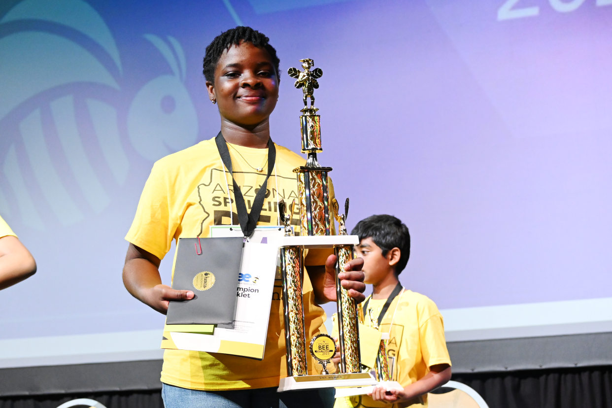 Karen Opoku-Appoh, 13, holds a fist place prize after winning the Arizona Spelling Bee on March 18, 2023.