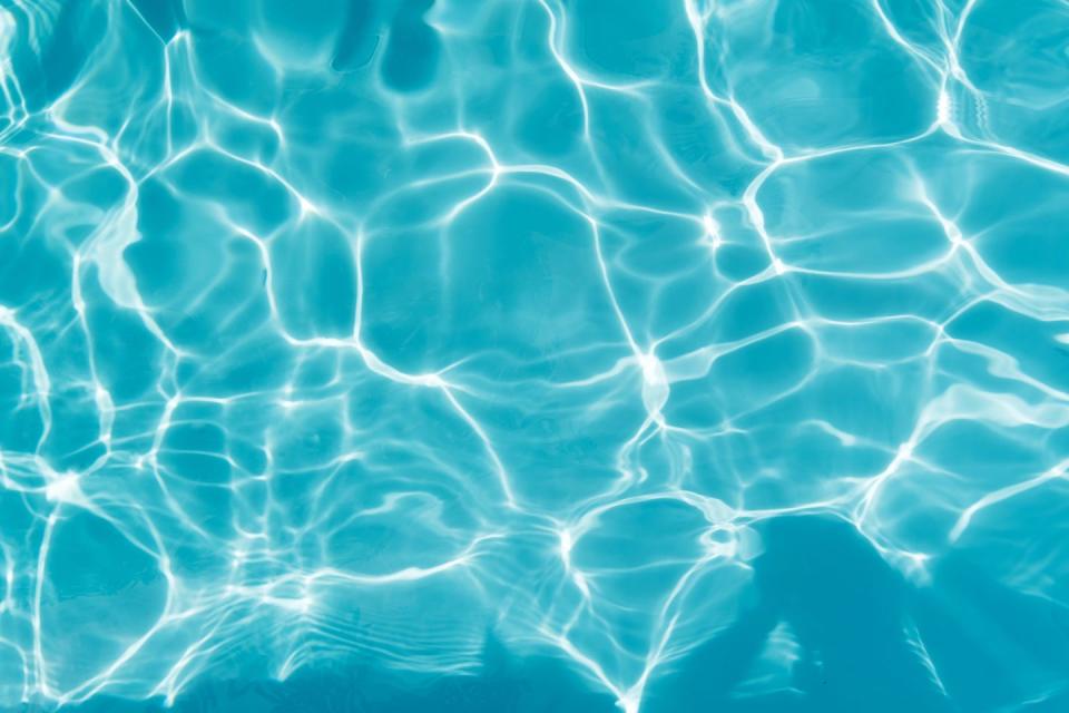 shallow vibrant color blue pool water background