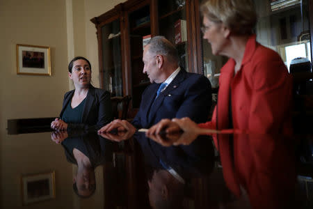 Leandra English (L), current acting director of the Consumer Financial Protection Bureau (CFPB) meets with Senate Democratic Leader Chuck Schumer (D-NY) and Senator Elizabeth Warren (D-MA) in Capitol Hill, Washington, D.C., November 27, 2017. REUTERS/Carlos Barria