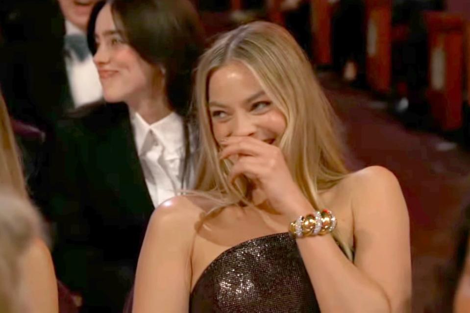 Margot Robbie laughed from the audience. ABC