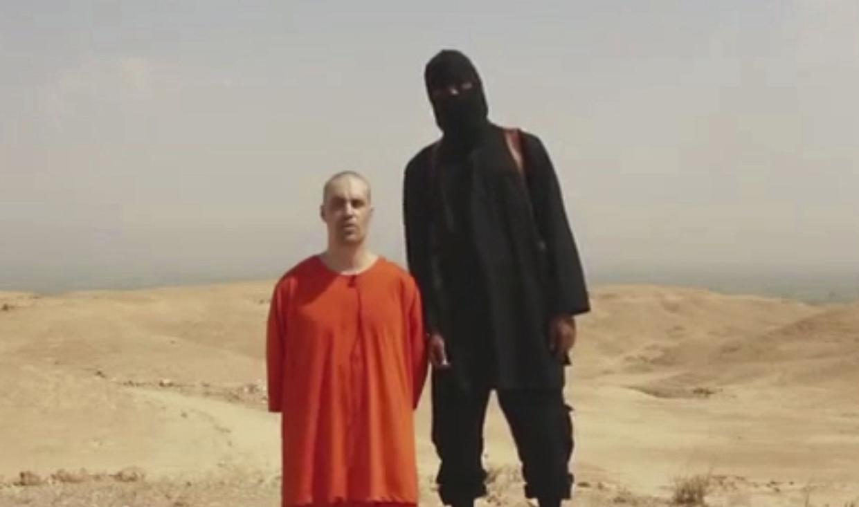 FILE - This undated image made from video released by Islamic State militants on Tuesday, Aug. 19, 2014, purports to show journalist James Foley before he was killed by the militant group. 