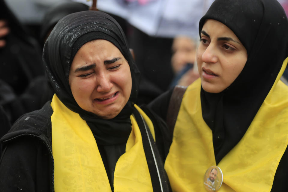 A woman mourns during the funeral of Hezbollah senior commander Ali Dibs who was killed by an Israeli airstrike Wednesday night, in Nabatiyeh town, south Lebanon, Friday, Feb. 16, 2024. Israel's military said it killed the senior commander with the militant Hezbollah group's elite Radwan Force, Ali Dibs, who it says played a role in an attack inside Israel last year that unnerved Israelis, as well as other attacks directed at Israel over the past four months. (AP Photo/Mohammed Zaatari)