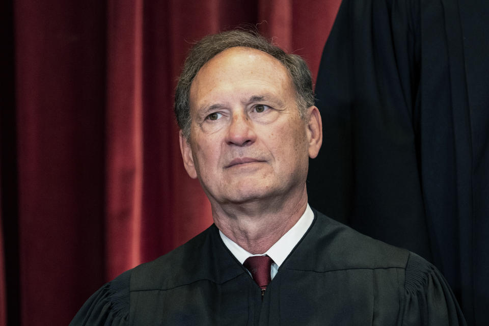 FILE - Associate Justice Samuel Alito sits during a group photo at the Supreme Court in Washington, April 23, 2021. The Supreme Court has ended constitutional protections for abortion that had been in place nearly 50 years — a decision by its conservative majority to overturn the court's landmark abortion cases. (Erin Schaff/The New York Times via AP, Pool, File)