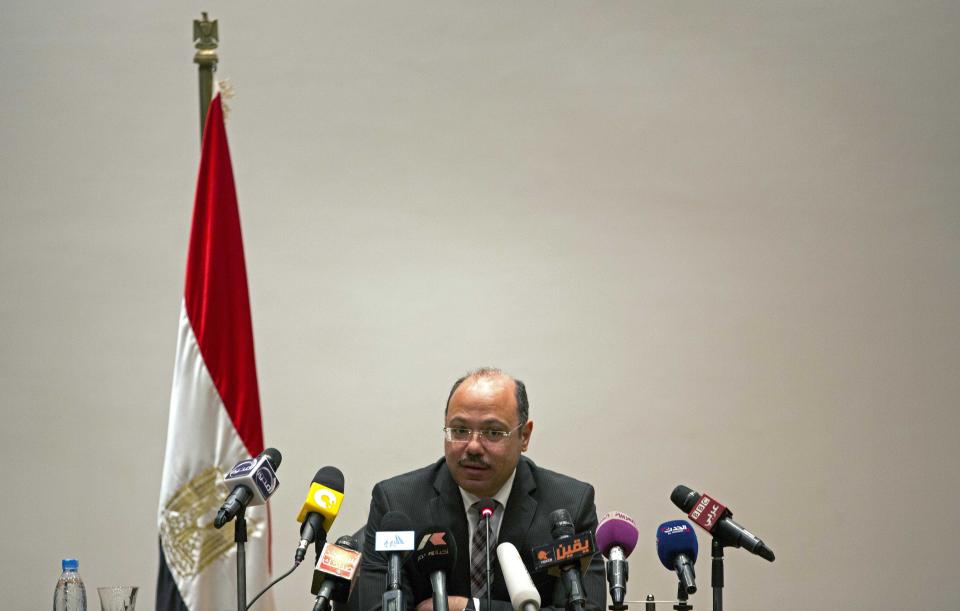 Egypt's Finance Minister, Hany Kadry Dimian, speaks to the media during a press conference in Cairo, Egypt Wednesday, March 12, 2014. Dimian says economic growth will remain at around 2 or 2.5 percent for 2013-14, rather than increase as his predecessor had predicted. Dimian also told reporters Wednesday that the budget deficit will stay high at 12 percent. Last year's deficit of 13.7 percent was a record high, while growth was an anemic 2.1 percent. (AP Photo/Khalil Hamra)