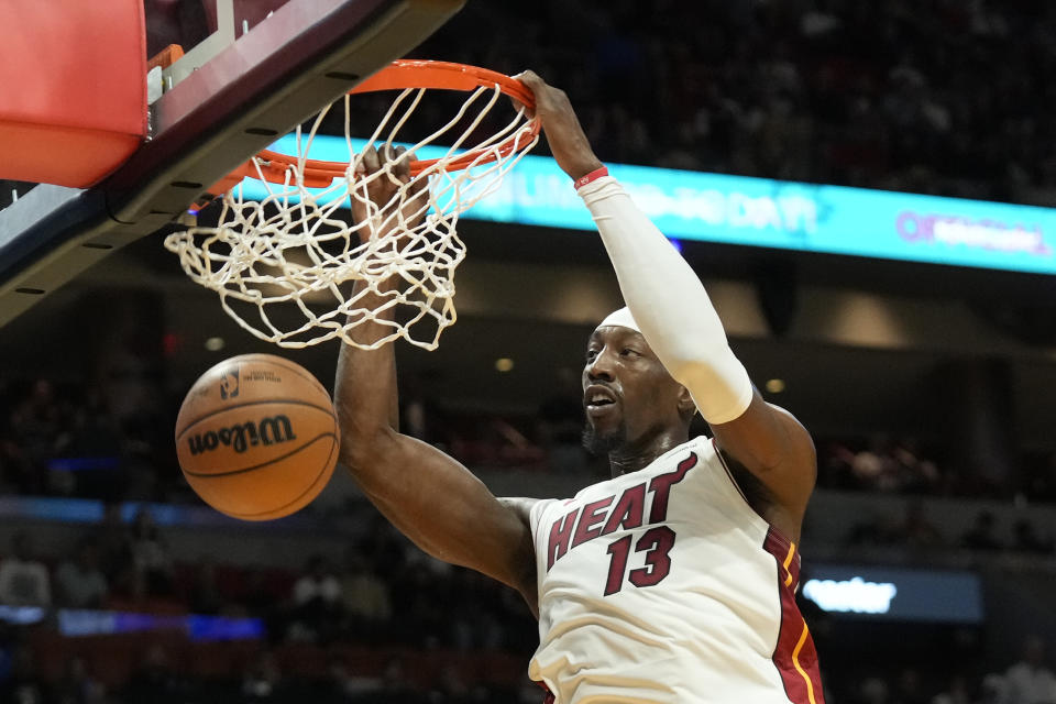 Miami Heat center Bam Adebayo dunks the ball during the first half of an NBA basketball game against the Brooklyn Nets, Wednesday, Nov. 1, 2023, in Miami. (AP Photo/Wilfredo Lee)