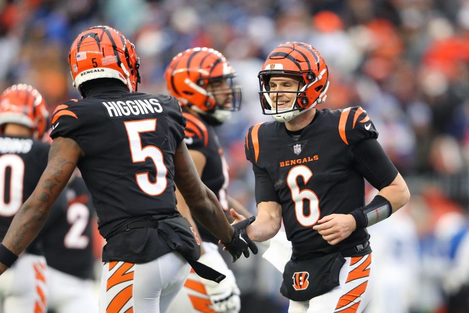 Dec 10, 2023; Cincinnati, Ohio, USA; Cincinnati Bengals quarterback Jake Browning (6) celebrates his touchdown run with wide receiver Tee Higgins (5) during the second half against the Indianapolis Colts at Paycor Stadium. Mandatory Credit: Joseph Maiorana-USA TODAY Sports