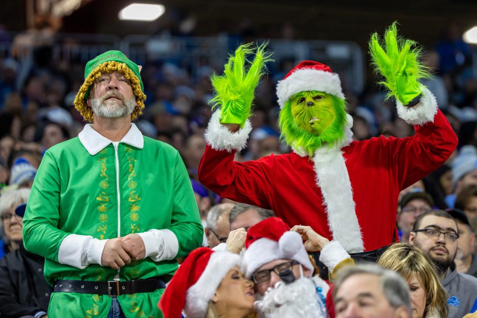 Detroit Lions fans dressed up in a Christmas theme during the first quarter of a game against the Minnesota Vikings at Ford Field.