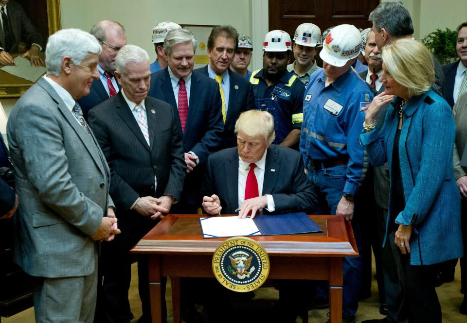 President Donald Trump signs H.J. Res. 38, disapproving the rule submitted by the  Department of the Interior known as the Stream Protection Rule in the Roosevelt Room of the White House on Feb. 16, 2017 in Washington. The Department of Interior's Stream Protection Rule, which was signed during the final month of the Obama administration, "addresses the impacts of surface coal mining operations on surface water, groundwater, and the productivity of mining operation sites," according to the Congress.gov summary of the resolution.