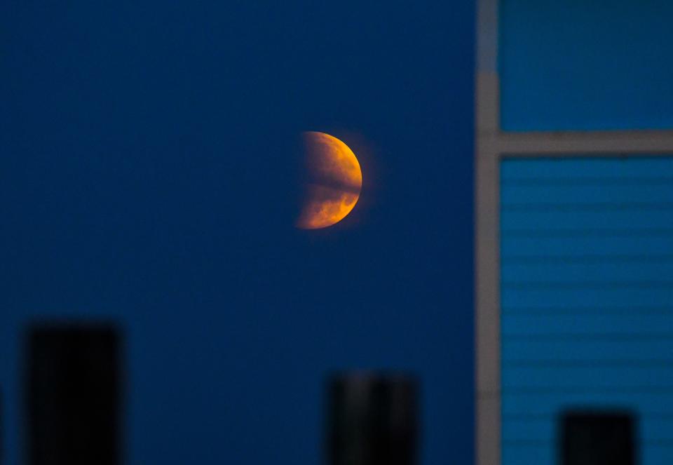A partial eclipse of the moon can be seen over the Banana River in south Cocoa Beach at dawn in Florida. The May 26 full Moon was the closest full moon of the year, making it the second of two supermoons. According to the Farmer's Almanac the May full moon has many names, the Flower Moon, the Leaf Moon, the Planting Moon, the Frog Moon and the Moon of the Shedding Ponies.