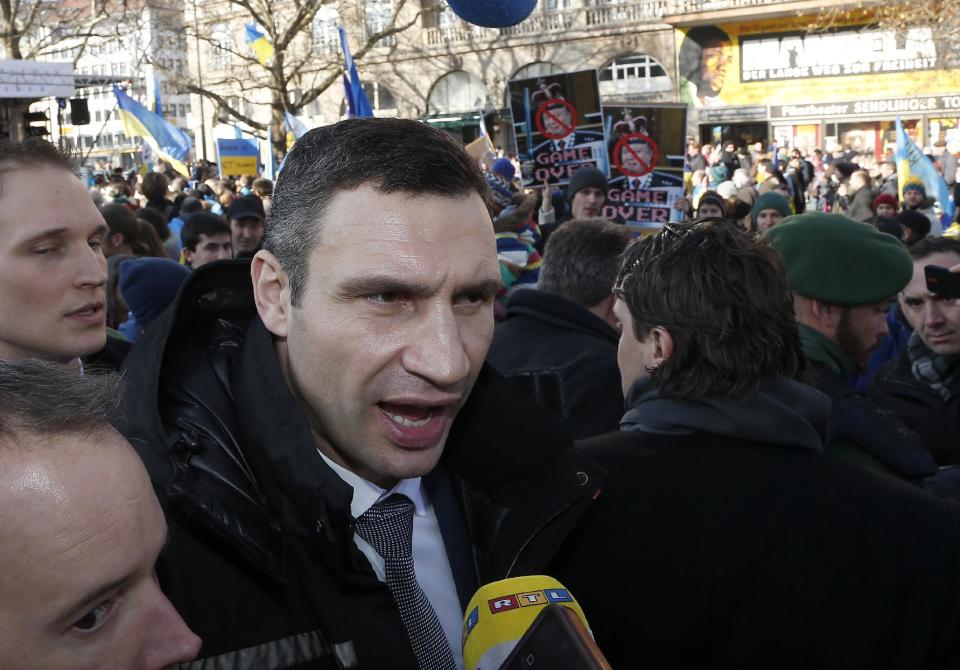 Ukraine's opposition leader Vitali Klitschko joins a demonstration against the Ukrainian government, during the 50th Security Conference in Munich, Germany, Saturday, Feb. 1, 2014. The conference on security policy takes place from Jan. 31, 2014 to Feb 2, 2014. (AP Photo/Frank Augstein)