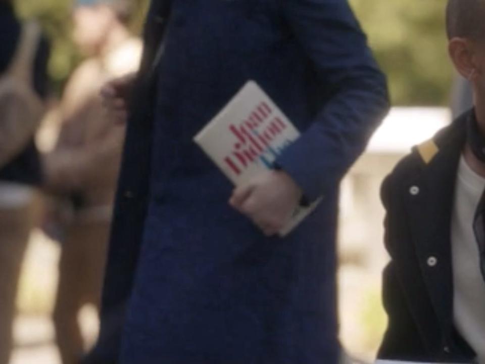 A student carry a collection of essays by Joan Didion on episode five of "Gossip Girl."