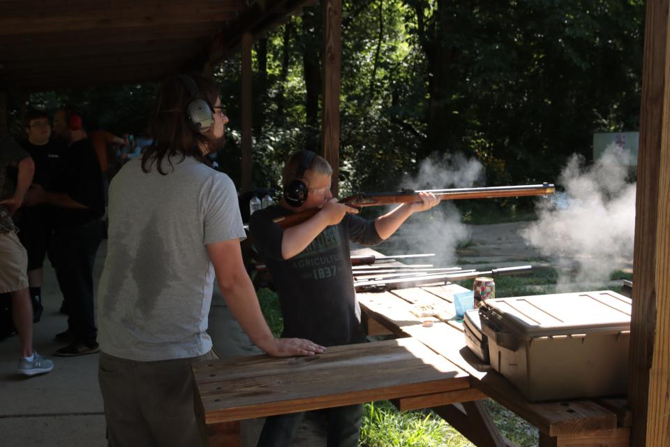 Clayton Thoroughman, 12, of Garden City shoots a muzzleloader while instructor Aaron Findley watches Saturday, Aug. 6, 2022, at the Lenawee County Conservation League.