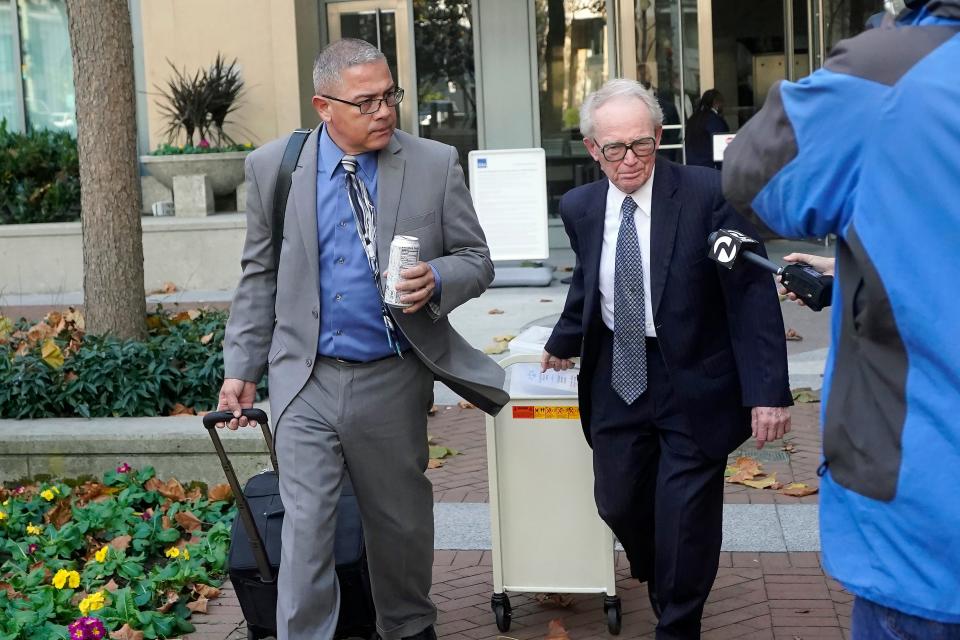 Former prison warden Ray Garcia, left, and his defense lawyer, James Reilly, leave the courthouse in Oakland, Calif. On Dec. 8, 2022, a federal jury convicted Garcia of seven counts involving sexually abusive conduct against three female victims who were serving prison sentences and one count of making false statements to government agents.