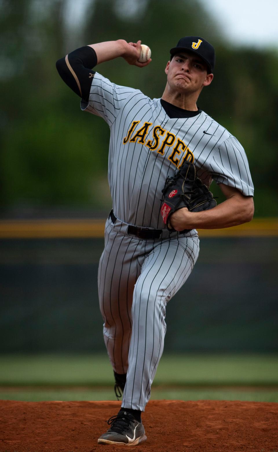 Jasper's Connor Foley (24) delivers a pitch to a Memorial batter at Memorial's Stone Field Monday afternoon, May 2, 2022.