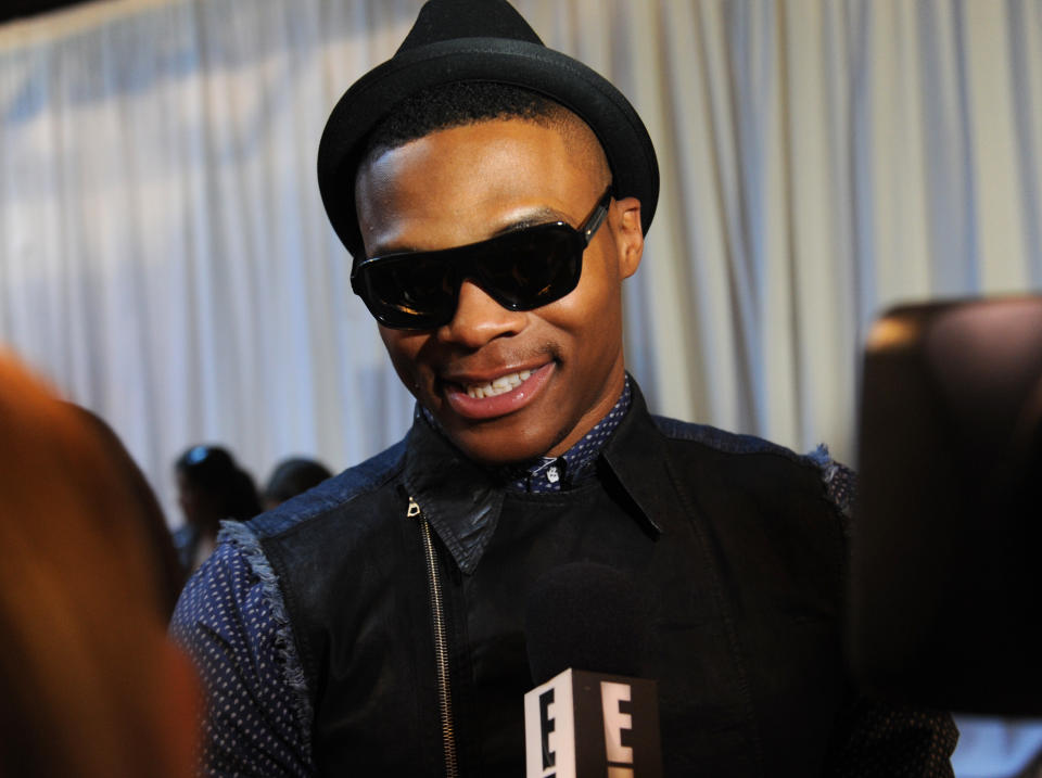 NBA basketball star Russell Westbrook, of the Oklahoma City Thunder is interviewed before the Rag & Bone Spring 2014 collection is modeled during Fashion Week, Friday, Sept. 6, 2013, in New York. (AP Photo/Louis Lanzano)