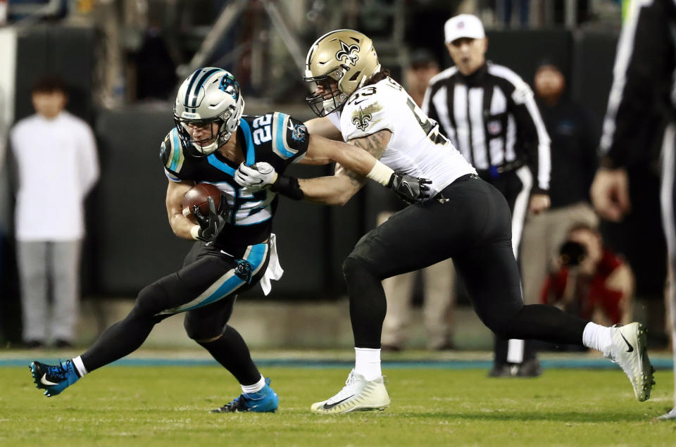 Carolina Panthers' Christian McCaffrey (22) runs past New Orleans Saints' A.J. Klein (53) in the first half of an NFL football game in Charlotte, N.C., Monday, Dec. 17, 2018. (AP Photo/Jason E. Miczek)