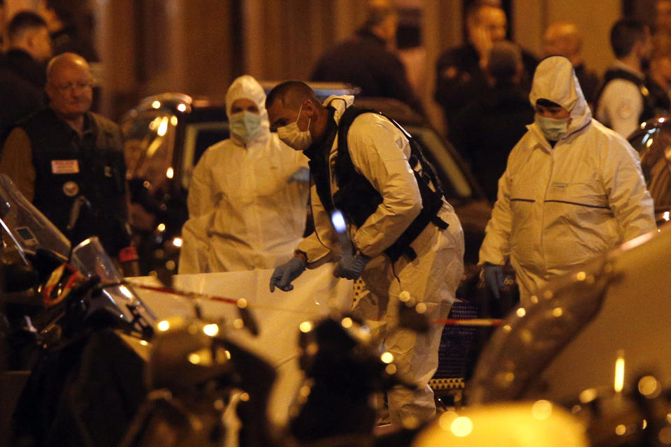 <p>Scientific police officers investigate after a knife attack in central Paris, Saturday May 12, 2018. (Photo: Thibault Camus/AP) </p>