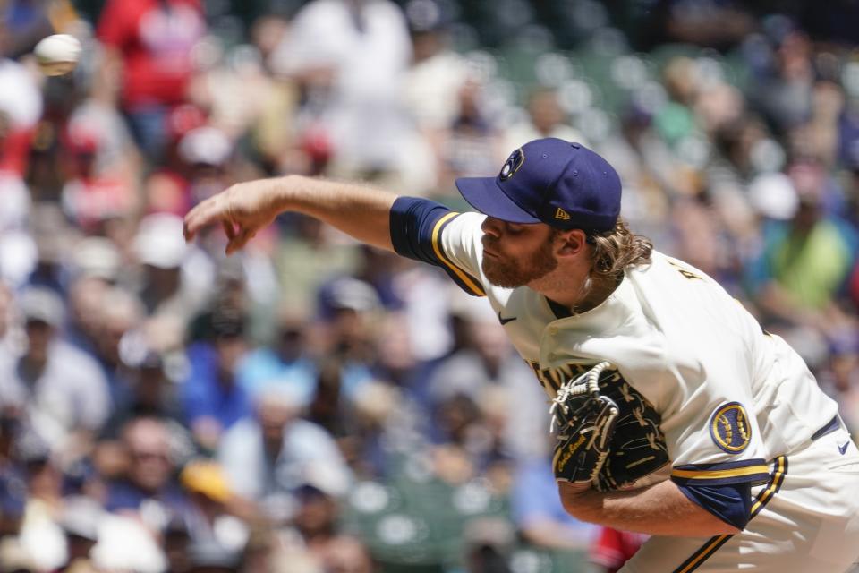 Milwaukee Brewers starting pitcher Corbin Burnes throws during the first inning of a baseball game against the Philadelphia Phillies Thursday, June 9, 2022, in Milwaukee. (AP Photo/Morry Gash)