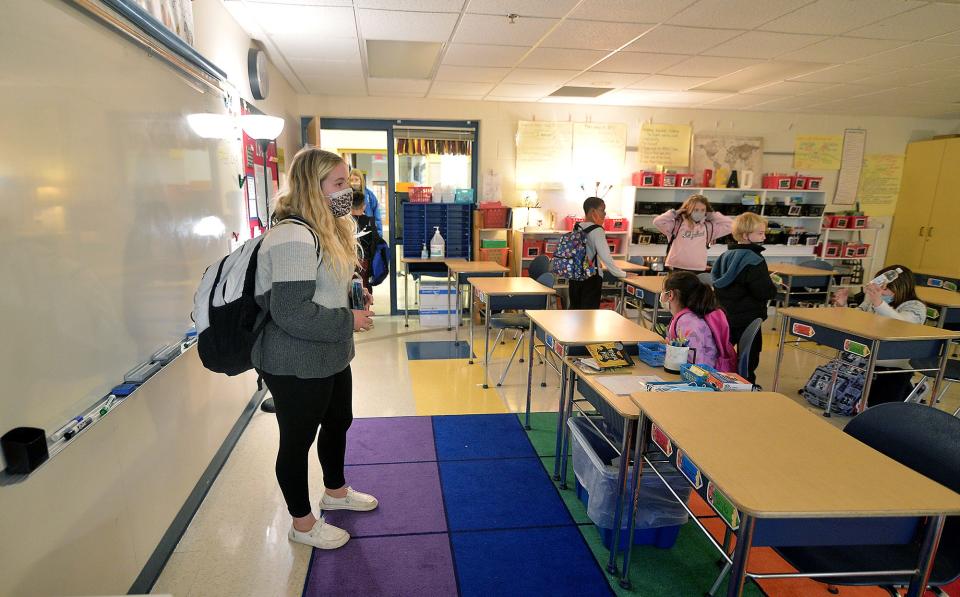 Faith Huntzberry, left, program staff member for "After the Bell," an after school program at Salem Avenue Elementary School, asks students to line up to go to their scheduled activity. Photo by Colleen McGrath/Herald-Mail.