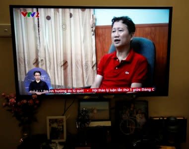 FILE PHOTO: An image of Vietnamese former oil executive Trinh Xuan Thanh is seen on a TV screen on state-run television VTV, saying he turns himself in at a police station in Hanoi, Vietnam August 3, 2017. REUTERS/Kham