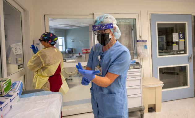 ICU nurses put on personal protective equipment in California, where COVID-19 cases are rising once again. (Photo: MediaNews Group/Orange County Register via Getty Images via Getty Images)