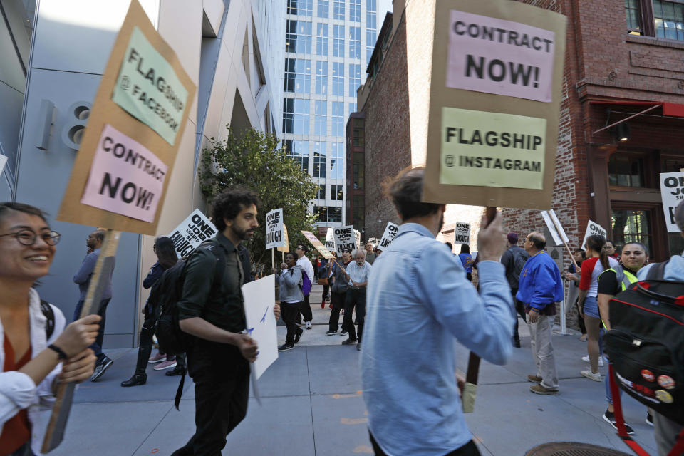 In this photo taken July 16, 2019, tech workers march to support Facebook's cafeteria workers, who were rallying for a new contract with their company Flagship in San Francisco. Tech workers are speaking out on issues of immigration, the environment, sexual misconduct and military warfare like never before. Google, Amazon and Microsoft employees protest against how their work is used by the government. Through petitions and collective actions, others push for better internal policies, greener practices and better work conditions for contractors. (AP Photo/Samantha Maldonado)