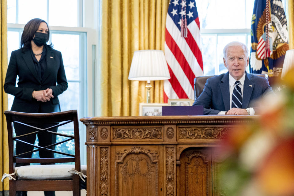 President Joe Biden, accompanied by Vice President Kamala Harris, speaks before signing the American Rescue Plan, a coronavirus relief package, in the Oval Office of the White House, Thursday, March 11, 2021, in Washington. (AP Photo/Andrew Harnik)