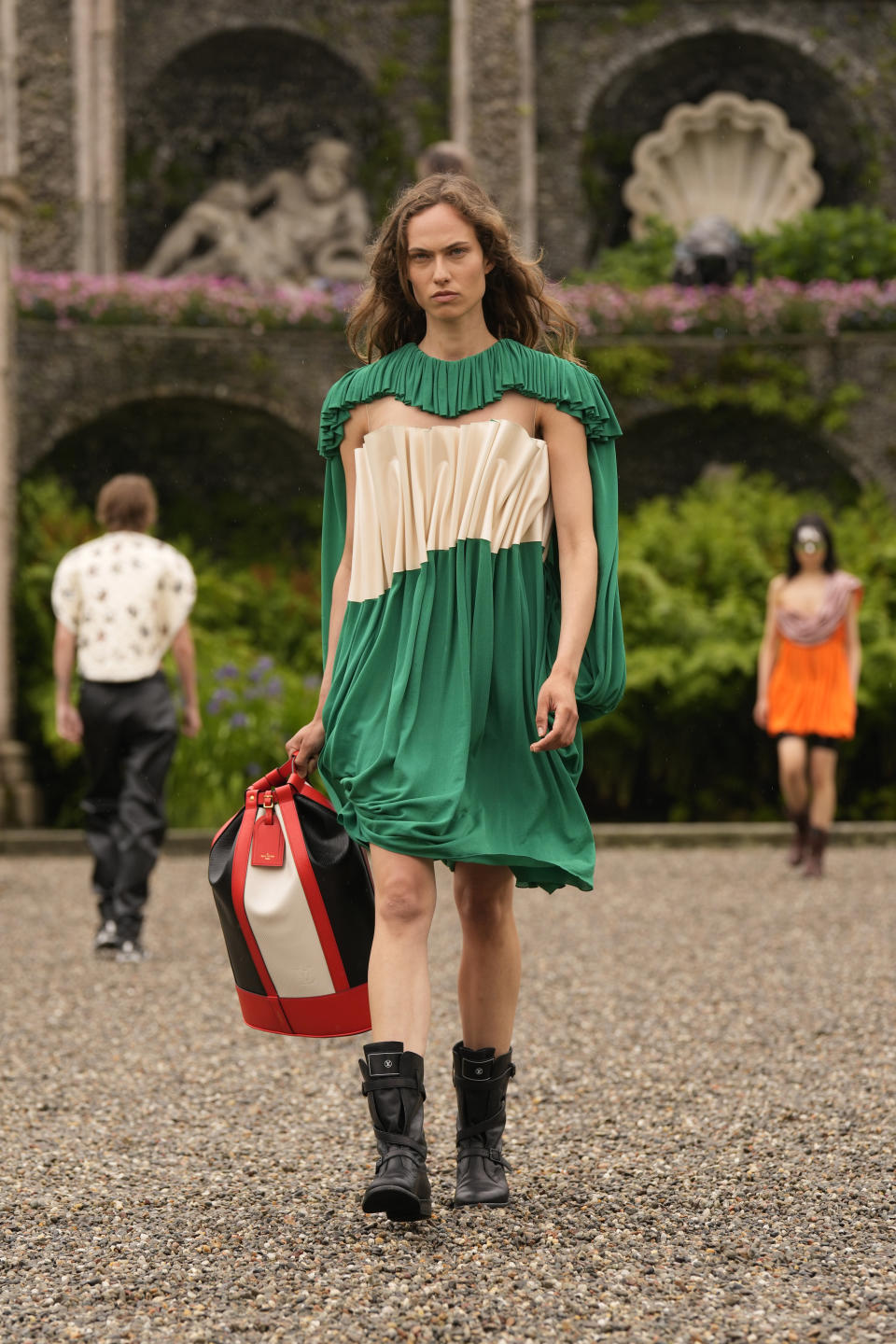 A model wears a creation as part of the women's Louis Vuitton Cruise 2024 collection, unveiled on Isola Bella (Bella Island) on Lake Maggiore in Stresa, northern Italy, Wednesday, May 24, 2023. (AP Photo/Antonio Calanni)