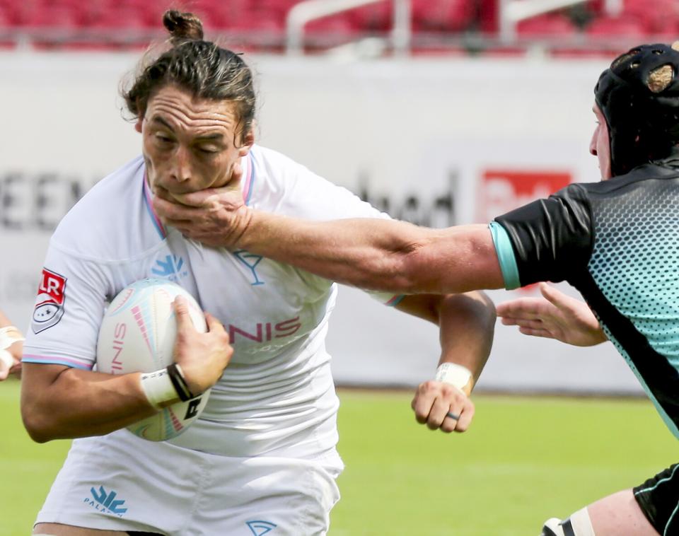 Los Angeles Giltinis flanker Zach Bonte gets a mouthful of a defender's hand.