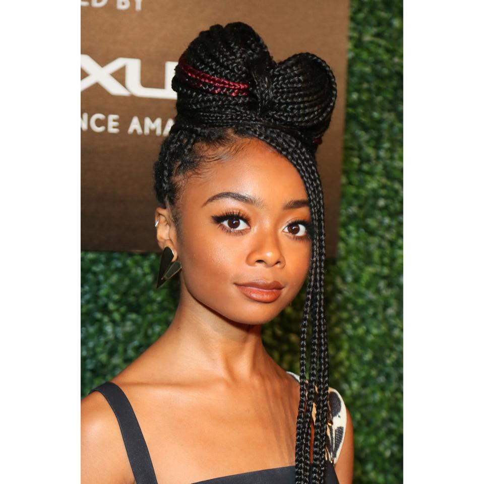 Tired of doing simple buns and ponytails and looking for a more unique updo? Look no further than actress Skai Jackson rocking the cutest braided bow with some of her braids left loose in the front. The burgundy strands of hair give this look an extra bit of flair.