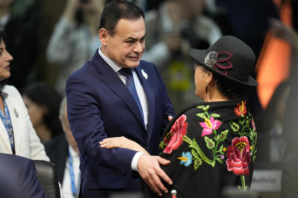 Paraguay's Foreign Minister Ruben Ramirez, left, greets Bolivia's Foreign Minister Celinda Sosa Lunda during the G20 foreign ministers meeting in Rio de Janeiro, Brazil, Wednesday, Feb. 21, 2024. (AP Photo/Silvia Izquierdo)