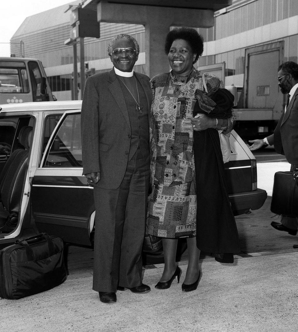 Desmond Tutu with his wife Leah at Heathrow Airport (PA) (PA Wire)