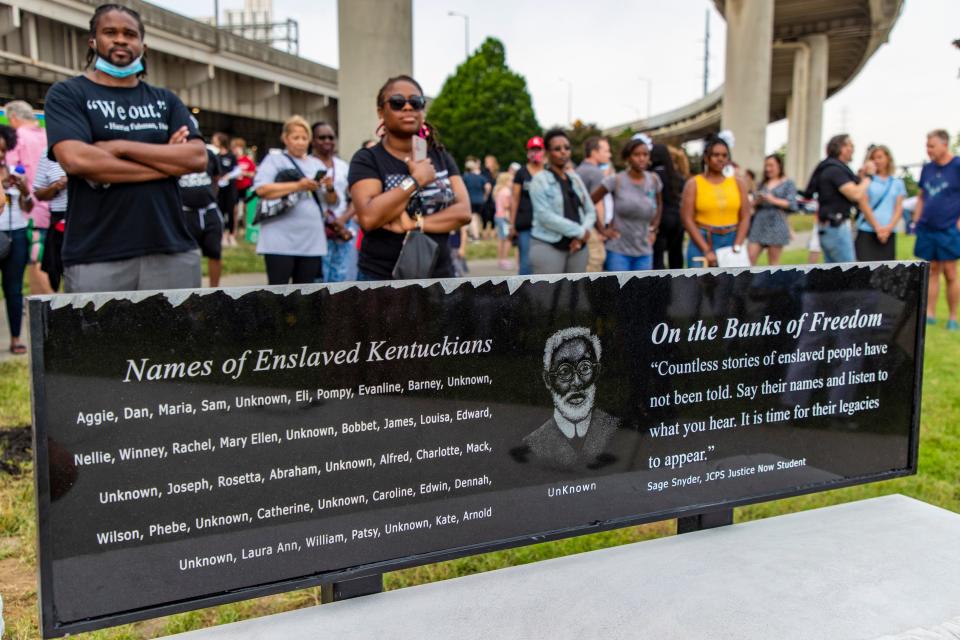 A list of names of former Kentucky slaves is engraved into a bench at the (Un)Known Project site on Juneteenth. June 19, 2021